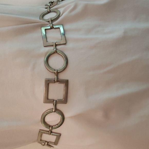 Accessories - This silver belt is 33 inches.  Silver circles and squares.